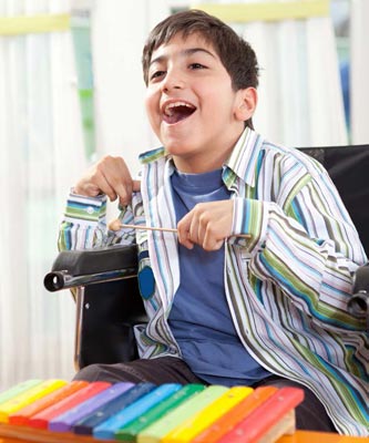 a young client playing the xylophone